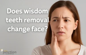 Young woman holding her jaw in concern about wisdom teeth removal affecting face shape