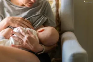 How to Prepare for Breastfeeding Mother breastfeeding her baby in a cozy environment, bonding and nurturing.