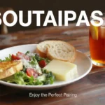 Soutaipasu food and drink pairing featuring a fresh salad with bread and iced tea on a wooden table.
