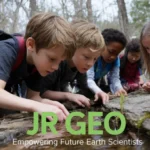 Jr Geo students exploring water in a forest, examining nature for hands-on learning